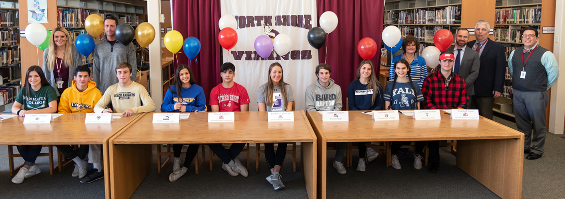 athletes sitting with balloons behind them